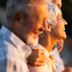 Smiling older couple.