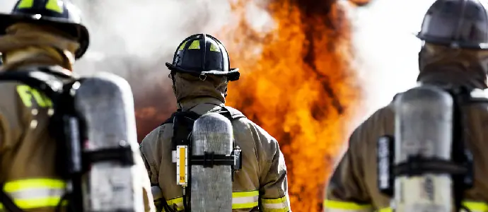 3 firemen heading towards flames