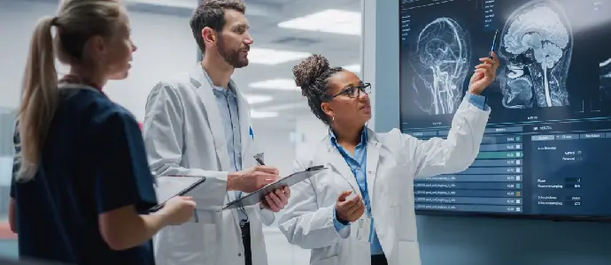 3 doctors looking at brain xray