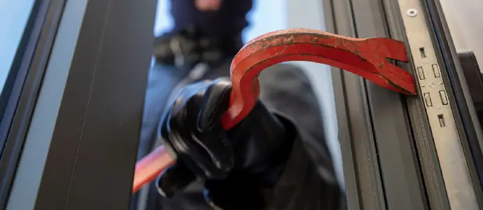 burglar breaking into a door