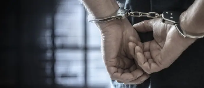mans hands in handcuffs